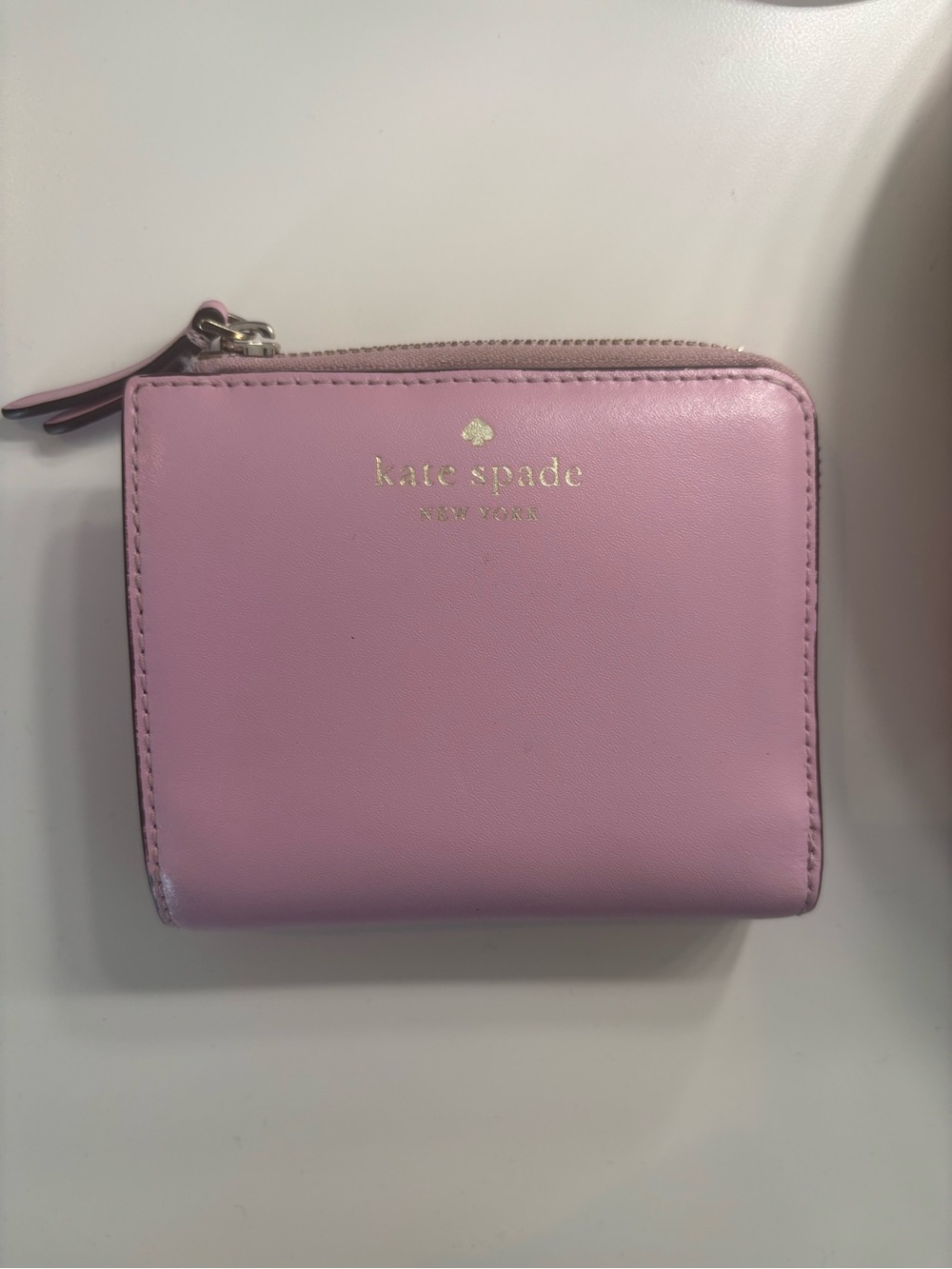 Kate Spade pink leather zip-around wallet
